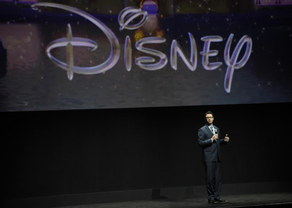 FILE - Dave Hollis, executive vice president of theatrical exhibition sales and distribution for Walt Disney Studios, talks about the studio's upcoming release schedule during the studio's presentation at CinemaCon 2015 at Caesars Palace on April 22, 2015, in Las Vegas. Hollis, who left his spot as a Disney executive to join this then-wife Rachel Hollis in running her lifestyles empire, which include her bestselling book “Girl, Wash Your Face,” has died at his home in Texas on Sunday, Feb. 12, 2023. He was 47. (Photo by Chris Pizzello/Invision/AP, File)