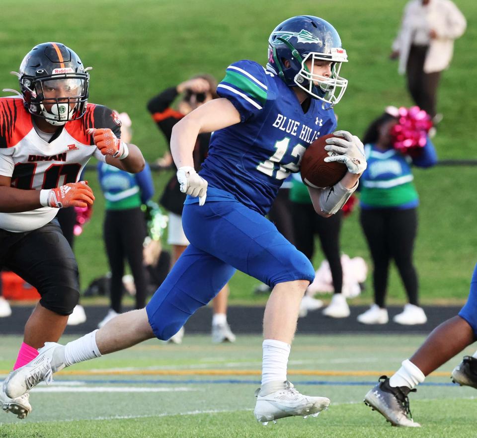 Blue Hills running Aidan Landers carries the football versus Diman during a game on Thursday, Oct, 12, 2023.