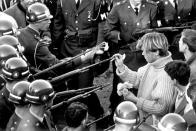 <p>Antiwar demonstrators try flower power on soldiers blocking the Pentagon Building in Arlington, Virginia, on October 21, 1967. </p>