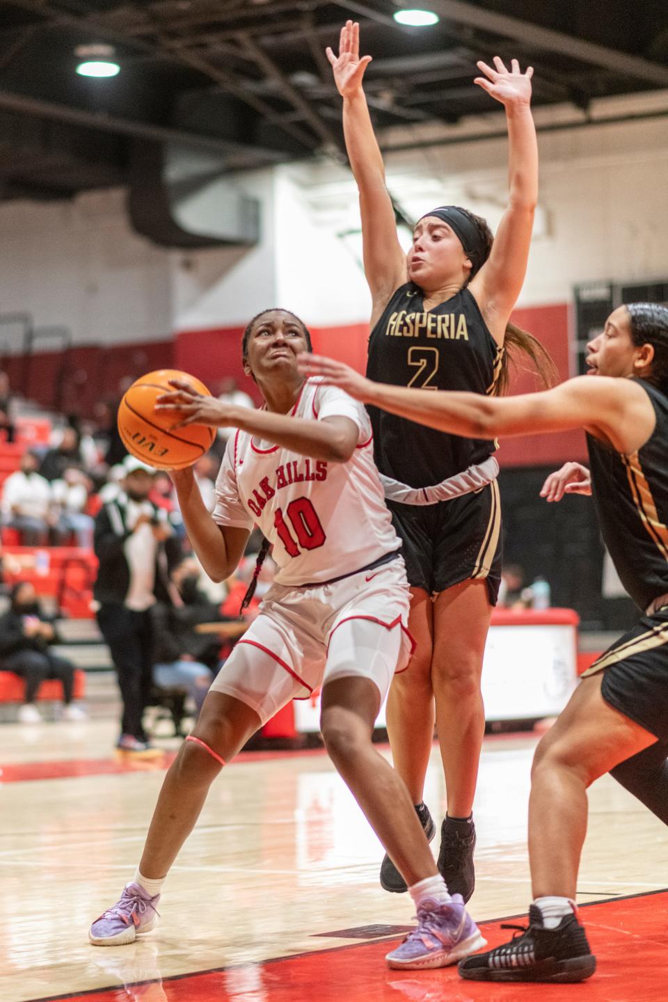 Oak Hills' Nukera Reddic shoots the ball against Oak Hills during the second half Friday, Jan. 21, 2022.