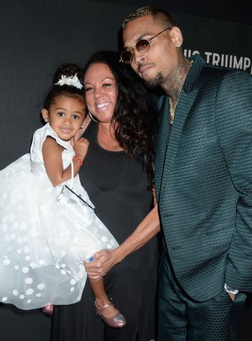 <p>Broadimage/Shutterstock</p> Chris Brown, daughter Royalty Brown and mother Joyce Hawkins at the 'Welcome To My Life' film premiere on June 6, 2017.