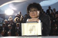 Director Bong Joon-ho poses with the Palme d'Or award for the film 'Parasite' during a photo call following the awards ceremony at the 72nd international film festival, Cannes, southern France, Saturday, May 25, 2019. (Photo by Vianney Le Caer/Invision/AP)