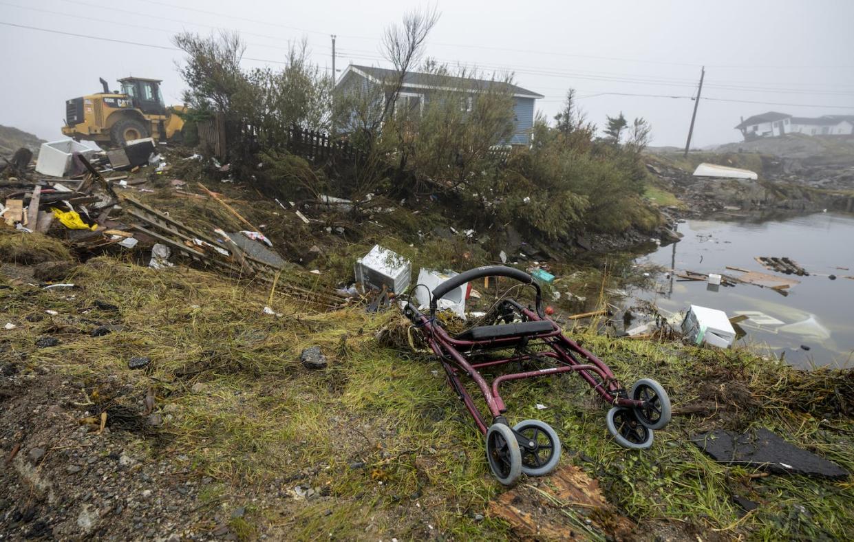 A walker lies among the debris following hurricane Fiona in Burnt Island, NL., on Sept. 28. THE CANADIAN PRESS/Frank Gunn