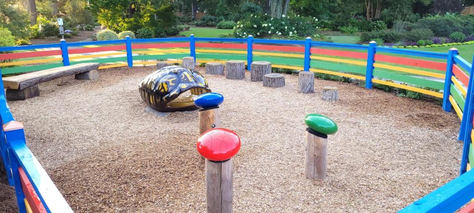 The renovated children’s garden play area includes nature-themed interaction.