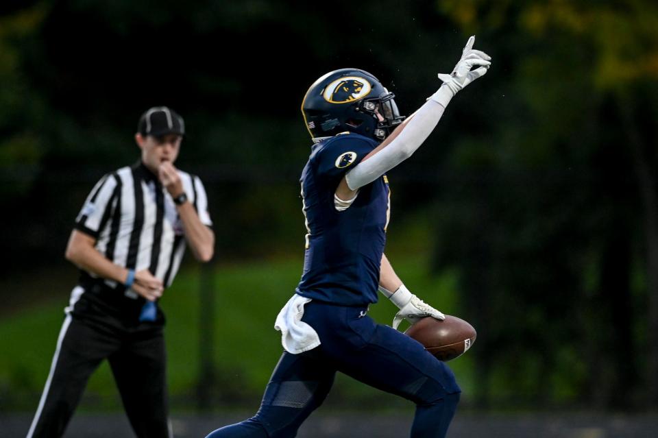 DeWitt's Abram Larner celebrates his touchdown run against Grand Ledge during the first quarter on Friday, Sept. 29, 2023, at DeWitt High School.