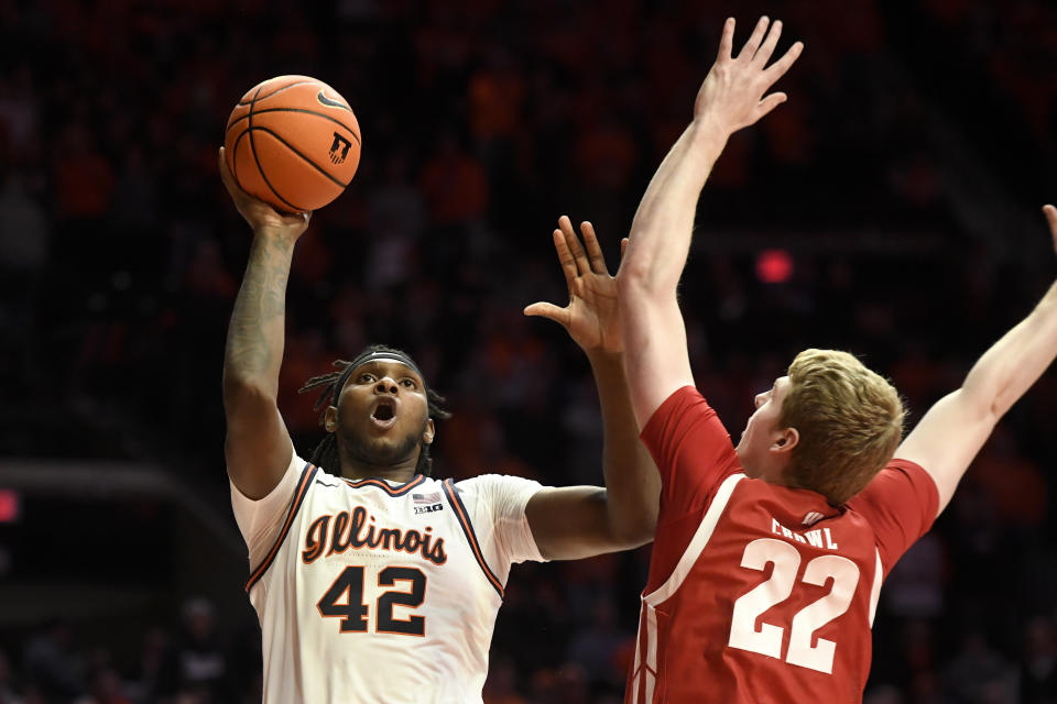 Illinois' Dain Dainja (42) shoots over Wisconsin's Steven Crowl (22) during the first half of an NCAA college basketball game, Saturday, Jan. 7, 2023, in Champaign, Ill. (AP Photo/Michael Allio)