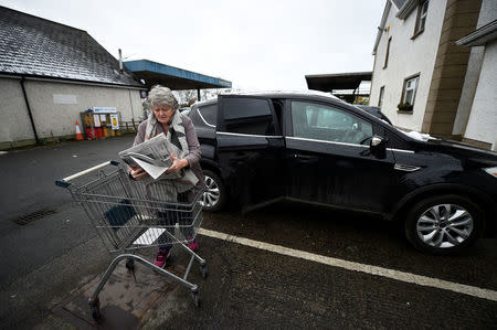 Alice Mullen from Monaghan in the Republic of Ireland does her shopping at a former customs post on the border in Middletown, Northern Ireland, December 9, 2017. "I'd be very worried if it was a hard border, I remember when people were divided. I would be very afraid of the threat to the peace process, it was a dreadful time to live through. Even to go to mass on a Sunday, you'd have to go through checkpoints. It is terribly stressful," said Mullen. "All those barricades and boundaries were pulled down. I see it as a huge big exercise of trust and I do believe everyone breathed a sigh of relief." REUTERS/Clodagh Kilcoyne