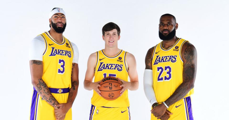 Anthony Davis, Austin Reaves and LeBron James pose for a promotional photo on the Los Angeles Lakers' media day. (Adam Pantozzi/NBAE via Getty Images)