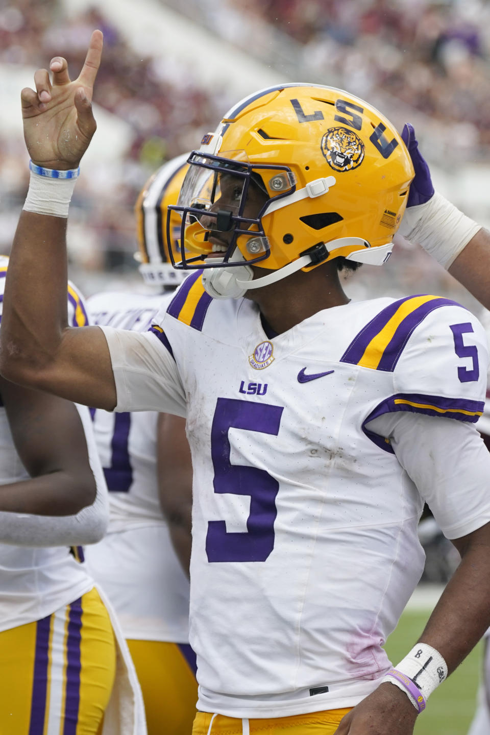 LSU quarterback Jayden Daniels (5) celebrates his touchdown against Mississippi State during the second half of an NCAA college football game, Saturday, Sept. 16, 2023, in Starkville, Miss. LSU won 41-14. (AP Photo/Rogelio V. Solis)