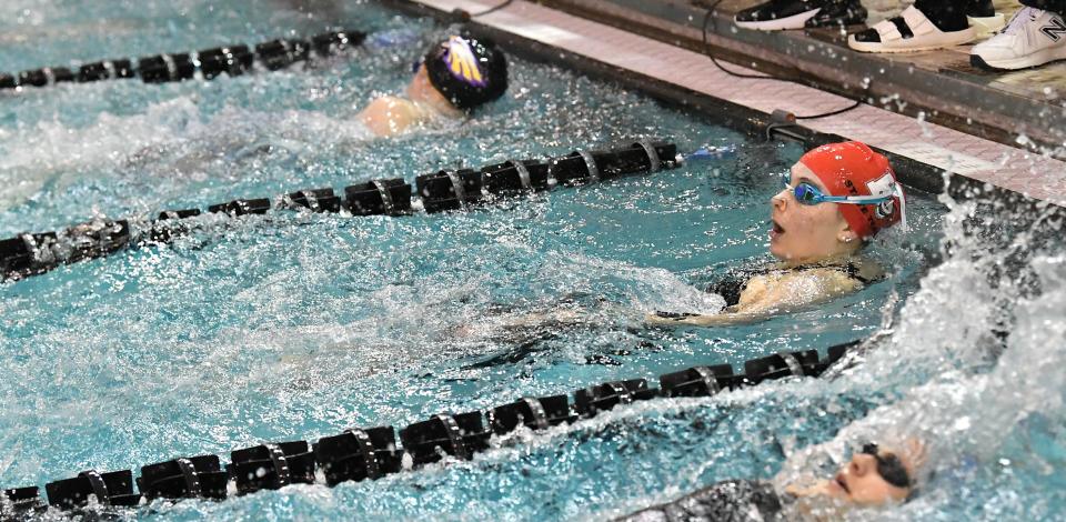 Maya Schweikert of Kings swims the backstroke to the wall and claims the title in the girls 100-yard backstroke at the Feb. 24, 2024, Ohio High School Athletic Association Division I state swimming and diving meet in Canton, Ohio.