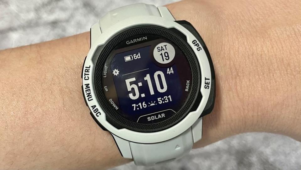 Garmin Instinct 2 watch with white strap