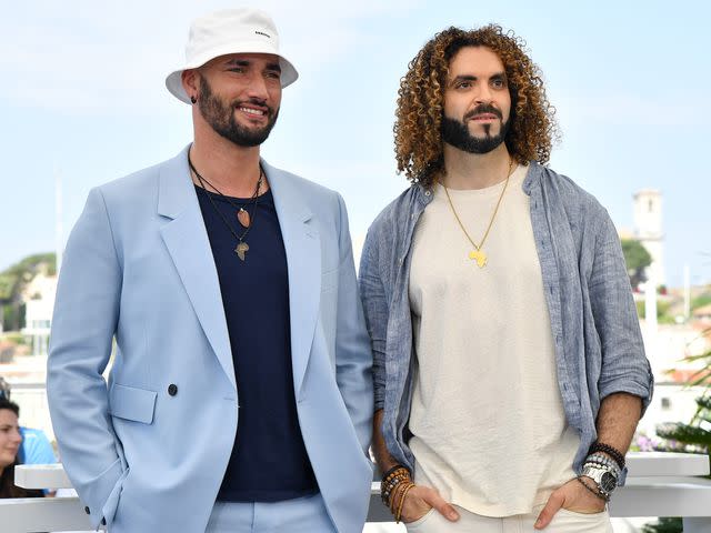 <p>Dominique Charriau/WireImage</p> Bilall Fallah and Adil El Arbi attend the photocall for "Rebel" during the 75th annual Cannes film festival on May 26, 2022 in Cannes, France.