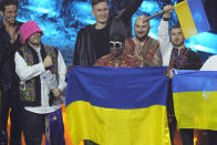 Kalush Orchestra from Ukraine celebrates after winning the Grand Final of the Eurovision Song Contest at Palaolimpico arena, in Turin, Italy, Saturday, May 14, 2022. (AP Photo/Luca Bruno)