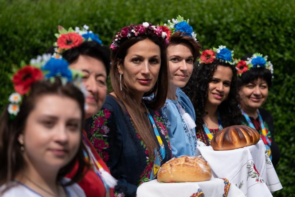 Kristina Korniiuk, 34, (third right) who fled the Ukraine following the Russian invasion, marks the Ukrainian celebration of Vyshyvanka Day at the home of her host Rend Platings in Cambridge (Joe Giddens/PA) (PA Wire)