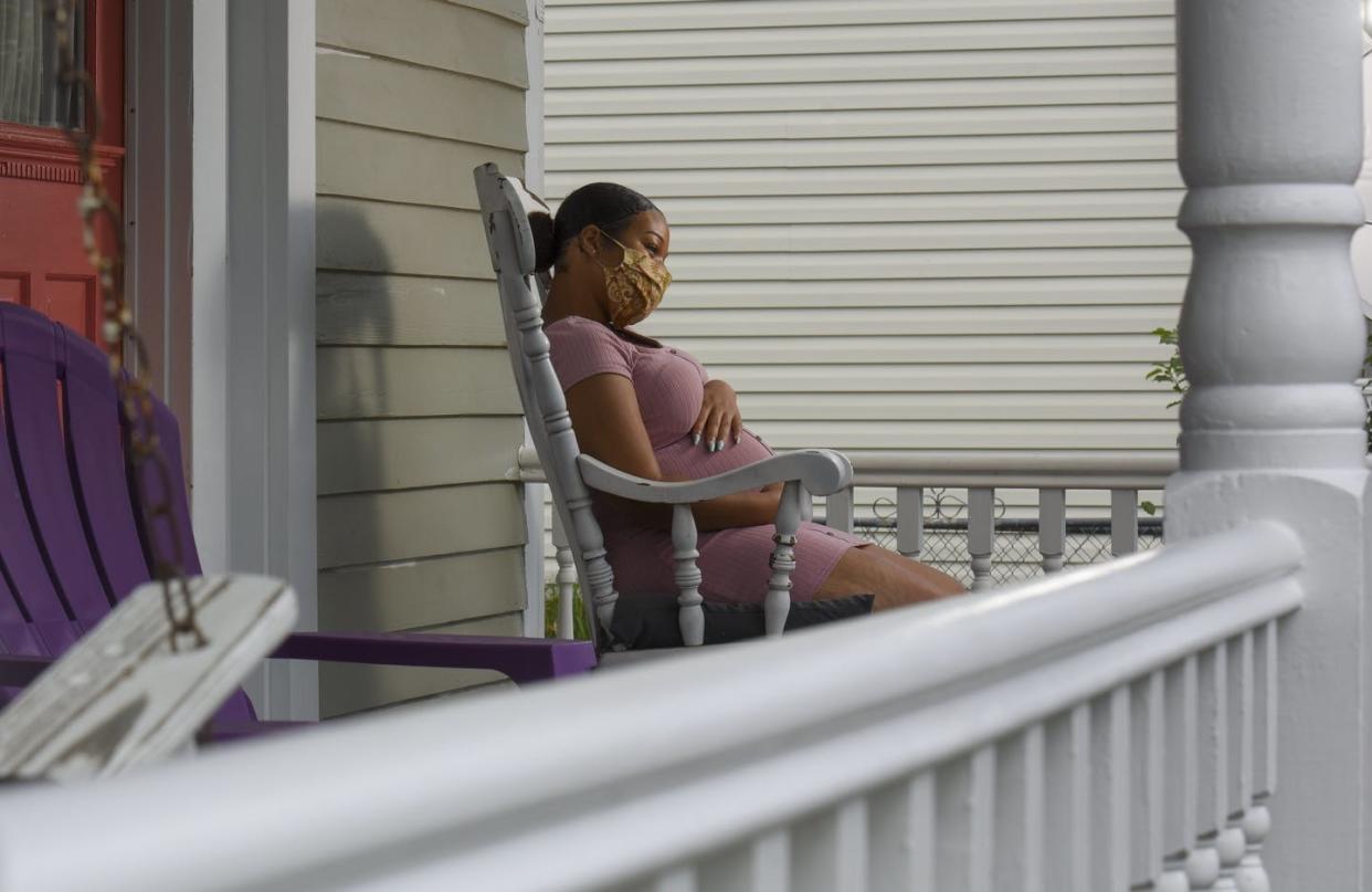 <span class="caption">Isolation and other pandemic stresses can harm pregnant women's mental health, with effects on their babies too.</span> <span class="attribution"><a class="link " href="https://www.gettyimages.com/detail/news-photo/kelsey-powell-five-months-pregnant-sits-for-a-portrait-at-a-news-photo/1223719121" rel="nofollow noopener" target="_blank" data-ylk="slk:Jahi Chikwendiu/The Washington Post via Getty Images;elm:context_link;itc:0;sec:content-canvas">Jahi Chikwendiu/The Washington Post via Getty Images</a></span>