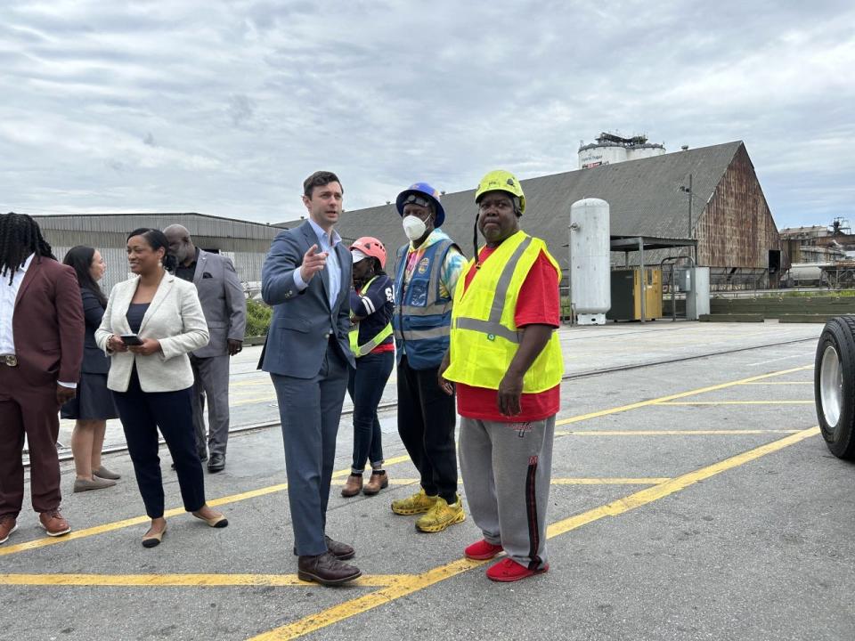 U.S. Sen. Jon Ossoff speaks with Georgia Ports Authority workers at the ports in Garden City on May 5, 2023.