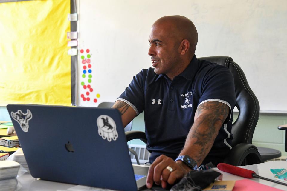 Red Cloud girls basketball coach Matt Rama chats while working in a classroom on June 15 on the Pine Ridge Reservation.