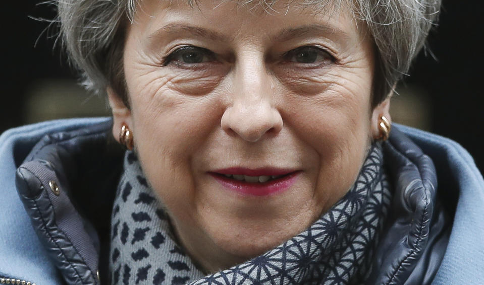 Britain's Prime Minister Theresa May leaves 10 Downing street to attend her weekly Prime Minster's Questions at the House of Commons, in London, Wednesday, March 27, 2019. British lawmakers are preparing to vote Wednesday on alternatives for leaving the European Union as they seek to end an impasse following the overwhelming defeat of the deal negotiated by Prime Minister Theresa May. (AP Photo/Alastair Grant)