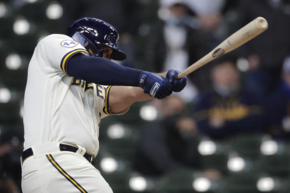 Milwaukee Brewers' Travis Shaw hits a two-RB double during the ninth inning of an opening day baseball game against the Minnesota Twins, Thursday, April 1, 2021, in Milwaukee. (AP Photo/Aaron Gash)