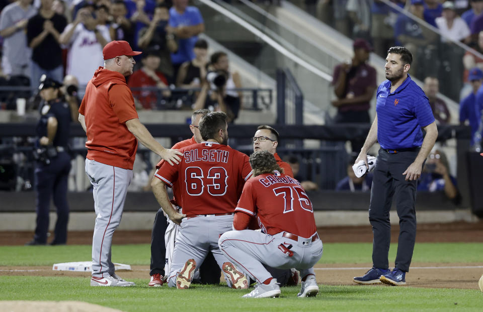 Angels pitcher Chase Silseth took a hard throw to the head against the Mets. (Photo by Jim McIsaac/Getty Images)
