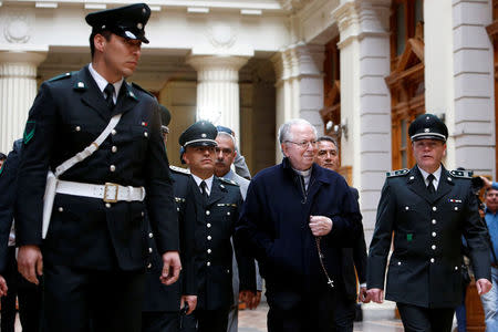 Chilean priest Fernando Karadima is escorted by gendarmes inside the Supreme Court building in Santiago, Chile, November 11, 2015. Picture taken November 11, 2015. REUTERS/Carlos Vera