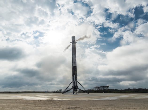 The Falcon 9 booster sits intact at Landing Zone 1. The booster will be trucked to SpaceX’s hangar for inspection and refurbishment. (SpaceX Photo)