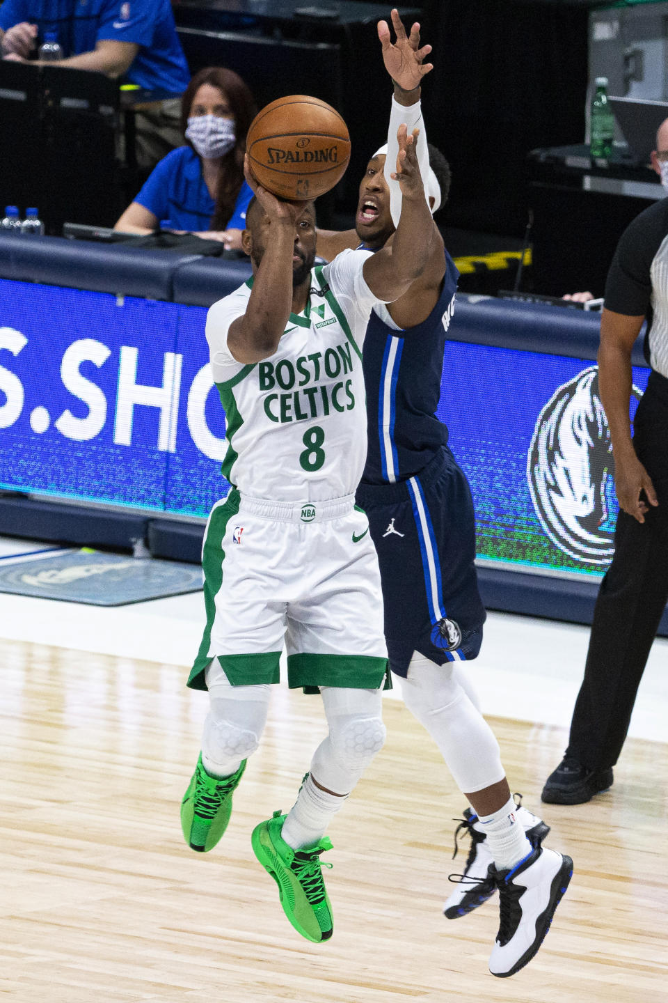 Boston Celtics guard Kemba Walker (8) shoots as Dallas Mavericks guard Josh Richardson defends during the first half of an NBA basketball game in Dallas, Tuesday, Feb. 23, 2021. (AP Photo/Sam Hodde)