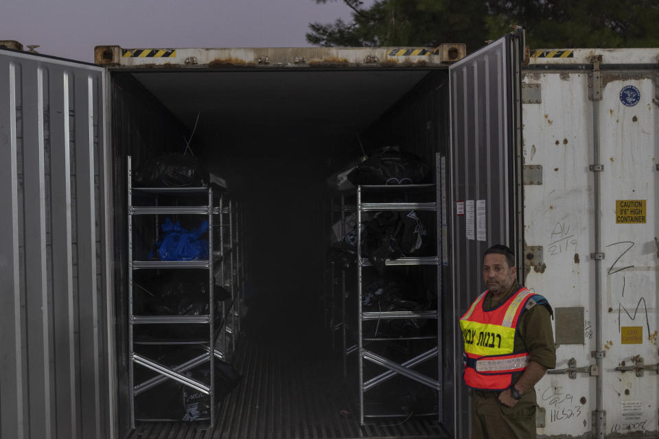 The bodies of Israelis killed in an Hamas militant attack are gathered in refrigerated containers for identification at a military base in Ramla, Israel, on Tuesday Oct. 24, 2023. Official said the 784 bodies have been identitified so far. Israeli officials say More than 1,400 people were killed and over 200 taken captive in Gaza, in the multi-front attack by the Hamas militant group on Oct. 7. (AP Photo/Petros Giannakouris)