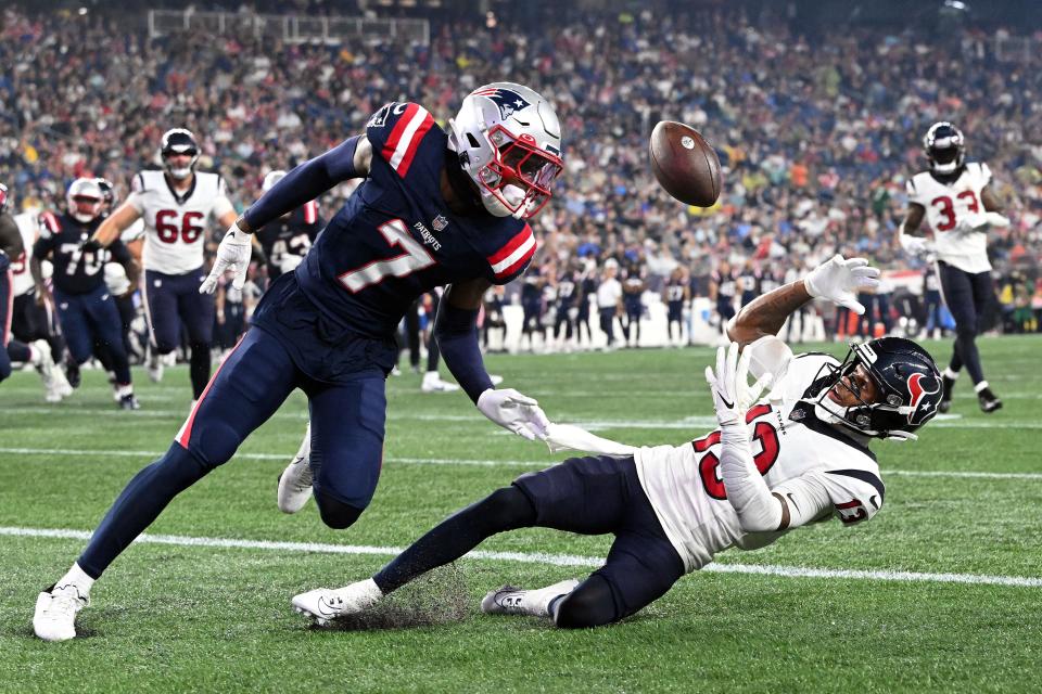 Aug 10, 2023; Foxborough, Massachusetts, USA; Houston Texans wide receiver Tank Dell (13) makes a catch for a touchdown against New England Patriots cornerback Isaiah Bolden (7) during the first half at Gillette Stadium. Mandatory Credit: Brian Fluharty-USA TODAY Sports