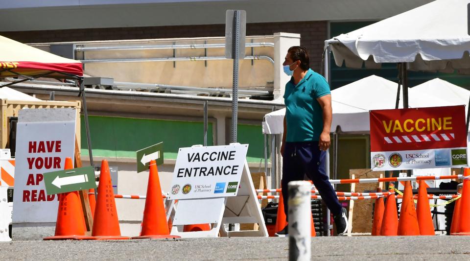 A man arrives at a near-empty Covid-19 vaccine facility in Los Angeles, California on May 3, 2021. (Frederic J. Brown/AFP via Getty Images)