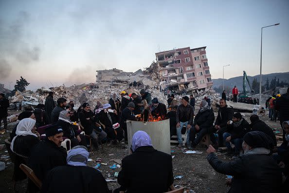 HATAY, TURKEY - FEBRUARY 09: People wait for news of their loved ones, believed to be trapped under collapsed building on  on February 09, 2023 in Hatay, Turkey. A 7.8-magnitude earthquake hit near Gaziantep, Turkey, in the early hours of Monday, followed by another 7.5-magnitude tremor just after midday. The quakes caused widespread destruction in southern Turkey and northern Syria and were felt in nearby countries. (Photo by Burak Kara/Getty Images)