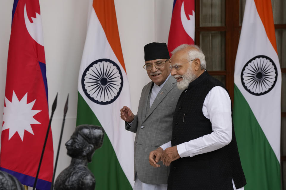 Nepal’s Prime Minister Pushpa Kamal Dahal and his Indian counterpart Narendra Modi, right, arrive for their meeting in New Delhi, India, Thursday, June 1, 2023. Dahal arrived Wednesday on a state visit, his first trip abroad since taking power in December last year. (AP Photo/Manish Swarup)