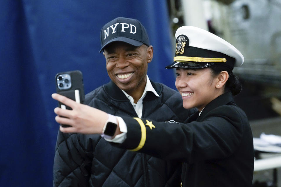 This photo, released by Office of the New York Mayor, shows New York Mayor Eric Adams, left, during his visit to the U.S. Navy ship USS New York, the day before Veterans Day, in New York, Friday, Nov. 10, 2023. FBI agents seized phones and an iPad from Adams this week as part of an investigation into his campaign finances, according to a published report, Friday, Nov. 10, 2023.(Michael Appleton/Mayoral Photography Office via AP)