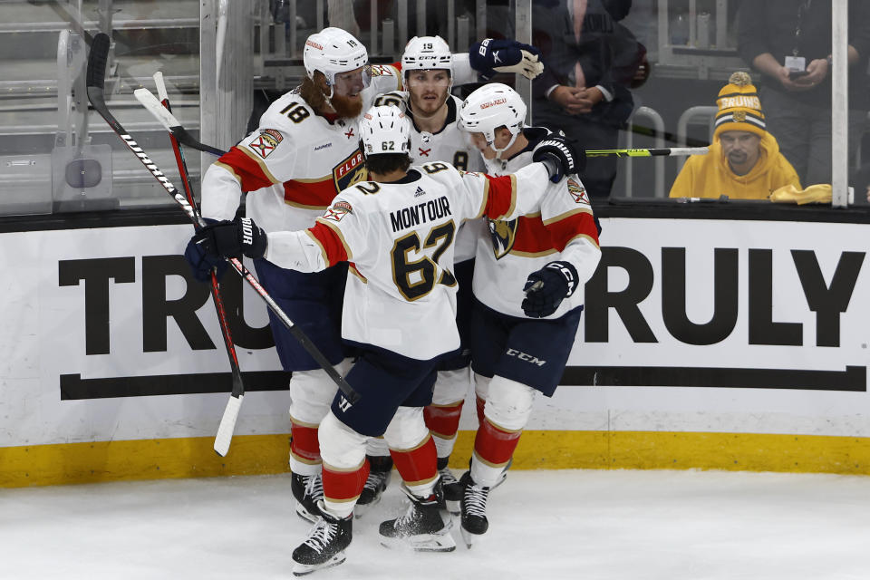 Florida Panthers' Matthew Tkachuk, center, is congratulated by Marc Staal (18) after his goal against the Boston Bruins during the second period of Game 1 of an NHL hockey playoff series Monday, April 17, 2023, in Boston. (AP Photo/Winslow Townson)