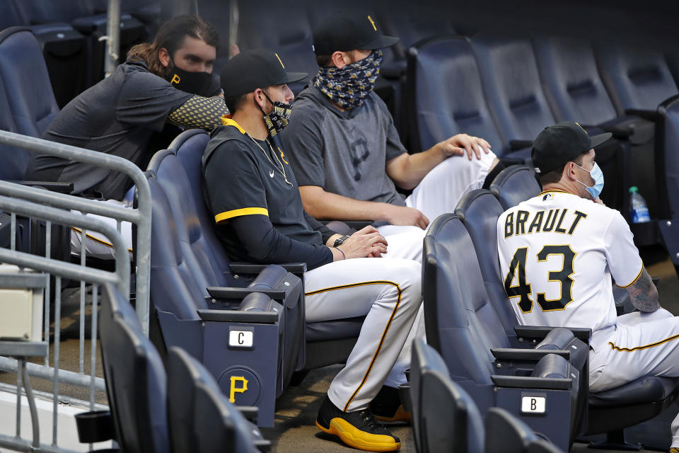 Pittsburgh Pirates starting pitchers from left Trevor Williams, Joe Musgrove, Chad Kuhl and Steven Brault (43) sit in the stands during a baseball game against the Cleveland Indians in Pittsburgh, Tuesday, Aug. 18, 2020. (AP Photo/Gene J. Puskar)