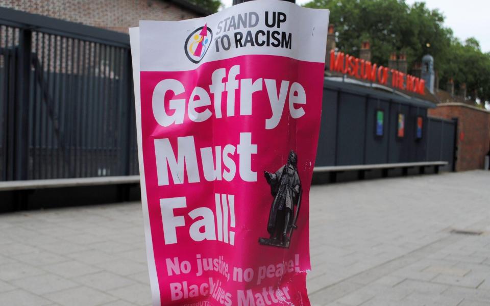 A Stand Up to Racism poster outside what was the Geffrye Museum in East London - Alamy