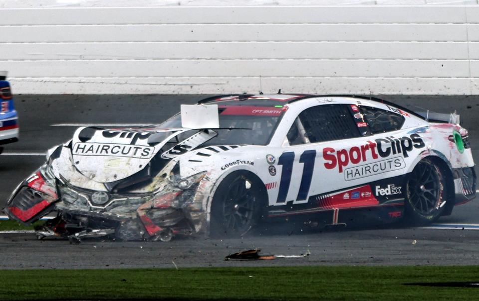 Denny Hamlin's car was destroyed after being flipped against the wall by Chase Elliott at the end of the second stage of Monday's Coca-Cola 600.