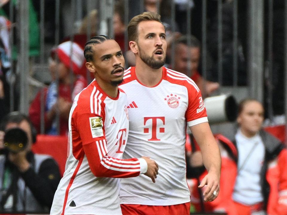Bayern Munich’s Harry Kane celebrates scoring with Leroy Sane (Reuters)