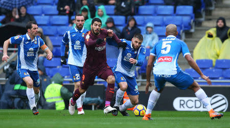 Soccer Football - La Liga Santander - Espanyol vs FC Barcelona - RCDE Stadium, Barcelona, Spain - February 4, 2018 Barcelona’s Luis Suarez in action with Espanyol’s David Lopez REUTERS/Albert Gea