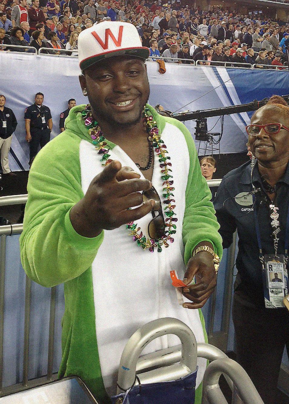 Denver Broncos running back Montee Ball smiles during the NCAA Final Four tournament college basketball semifinal game between Wisconsin and Kentucky Saturday, April 5, 2014, in Arlington, Texas. (AP Photo/Mark Long)