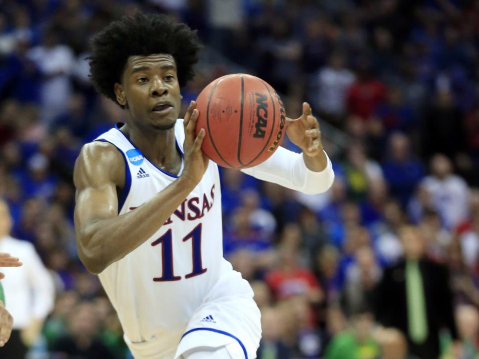 Josh Jackson passes the ball in a March 25, 2017, file photo. The former Kansas star must undergo anger management classes and apologize as part of a diversion agreement arising from a confrontation with a women's basketball player. (AP)