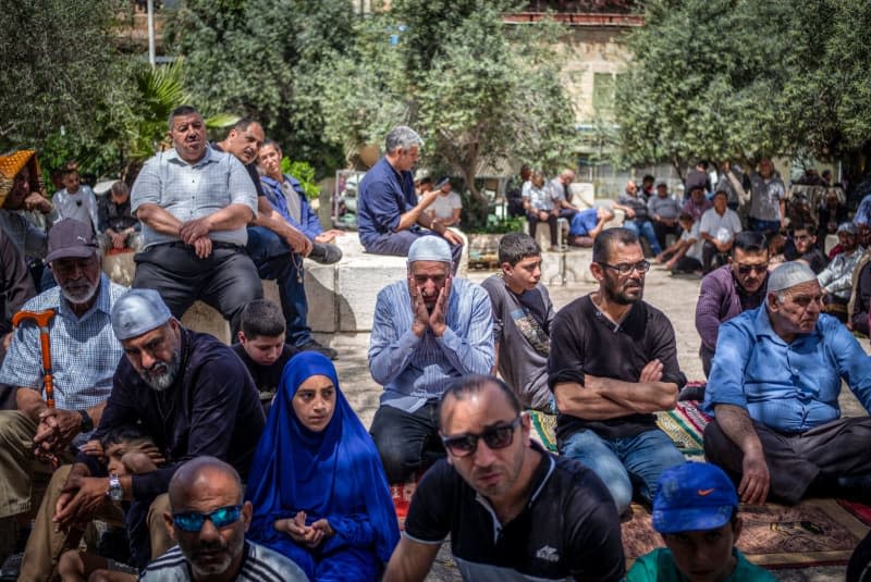 Muslim worshippers pray in the old city on the last Friday of the holy month of Ramadan, ahead of Laylat-al-Qadr (the night of destiny), believed in Islam to be the night when the Quran was first revealed to the Prophet Muhammad. Ilia Yefimovich/dpa