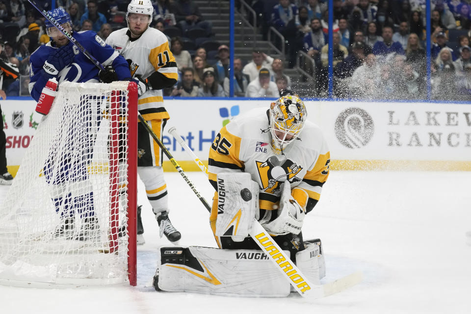 Pittsburgh Penguins goaltender Tristan Jarry (35) makes a save on a shot by the Tampa Bay Lightning during the second period of an NHL hockey game Wednesday, Dec. 6, 2023, in Tampa, Fla. (AP Photo/Chris O'Meara)