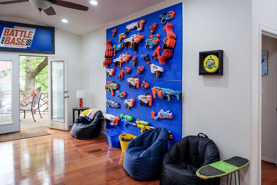 A wall of nerf guns at the Nerf House