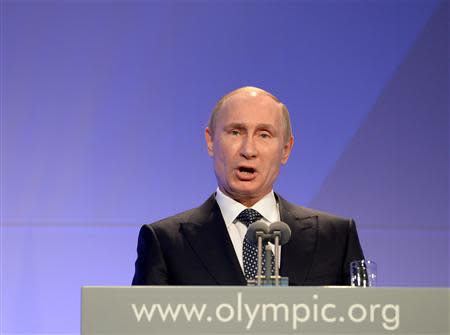 Russian President Vladimir Putin delivers his speech at the International Olympic Committee (IOC) Gala Dinner at the 2014 Sochi Winter Olympics, February 6, 2014. REUTERS/Andrej Isakovic/Pool