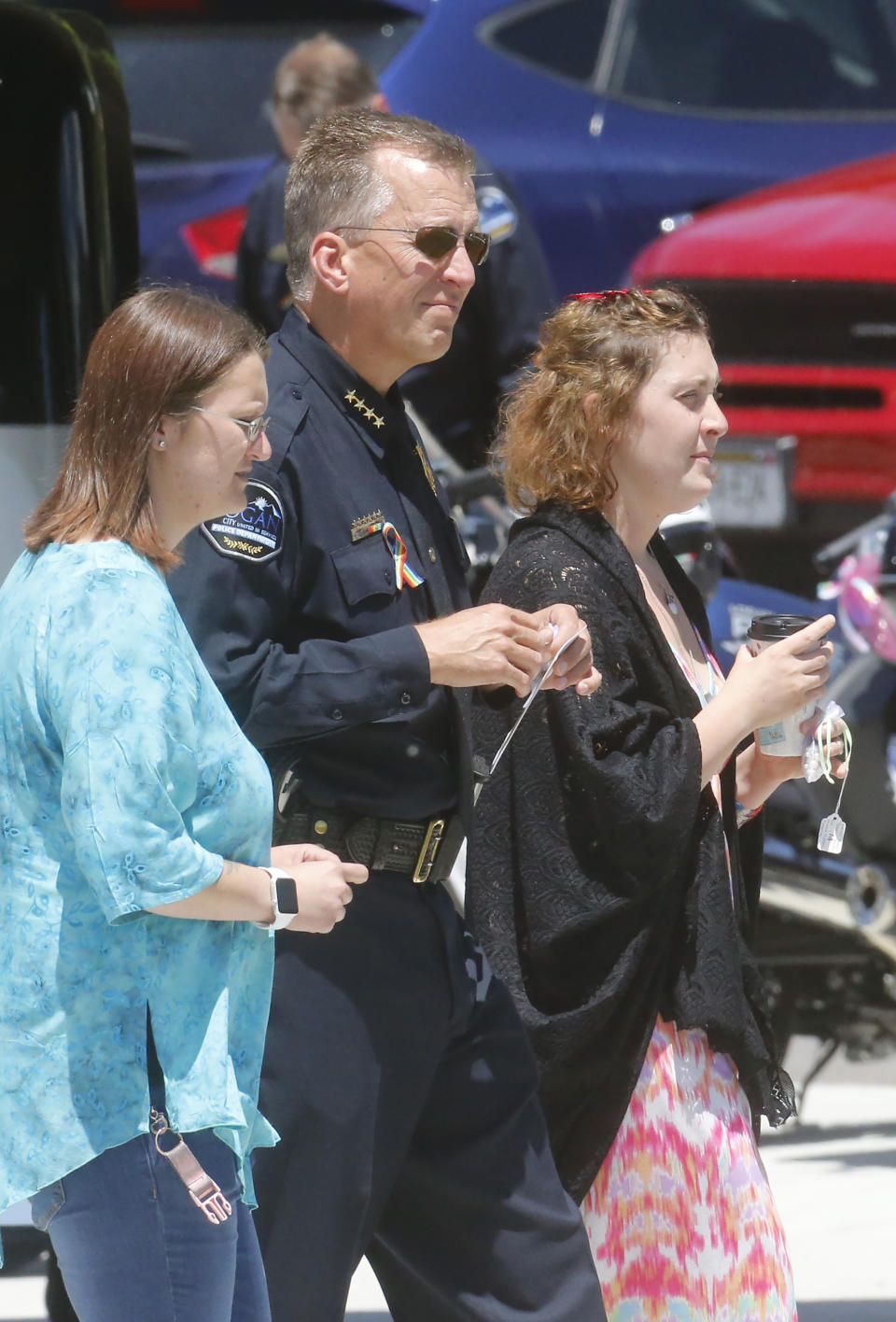 Jessica Whipple, right, walks with Logan Police Chief Gary Jensen, center, before the services at Nyman Funeral Home Tuesday, June 4, 2019, in Logan, Utah, for her daughter Elizabeth "Lizzy" Shelley, a 5-year-old girl who police say was taken from her home and killed by her uncle. Her uncle, Alex Whipple, is charged with killing her after his sister let him spend the night at the family's home, prosecutors said. Elizabeth "Lizzy" Shelley disappeared May 25 and was found dead less than a block from her home after a five-day search. (AP Photo/Rick Bowmer)