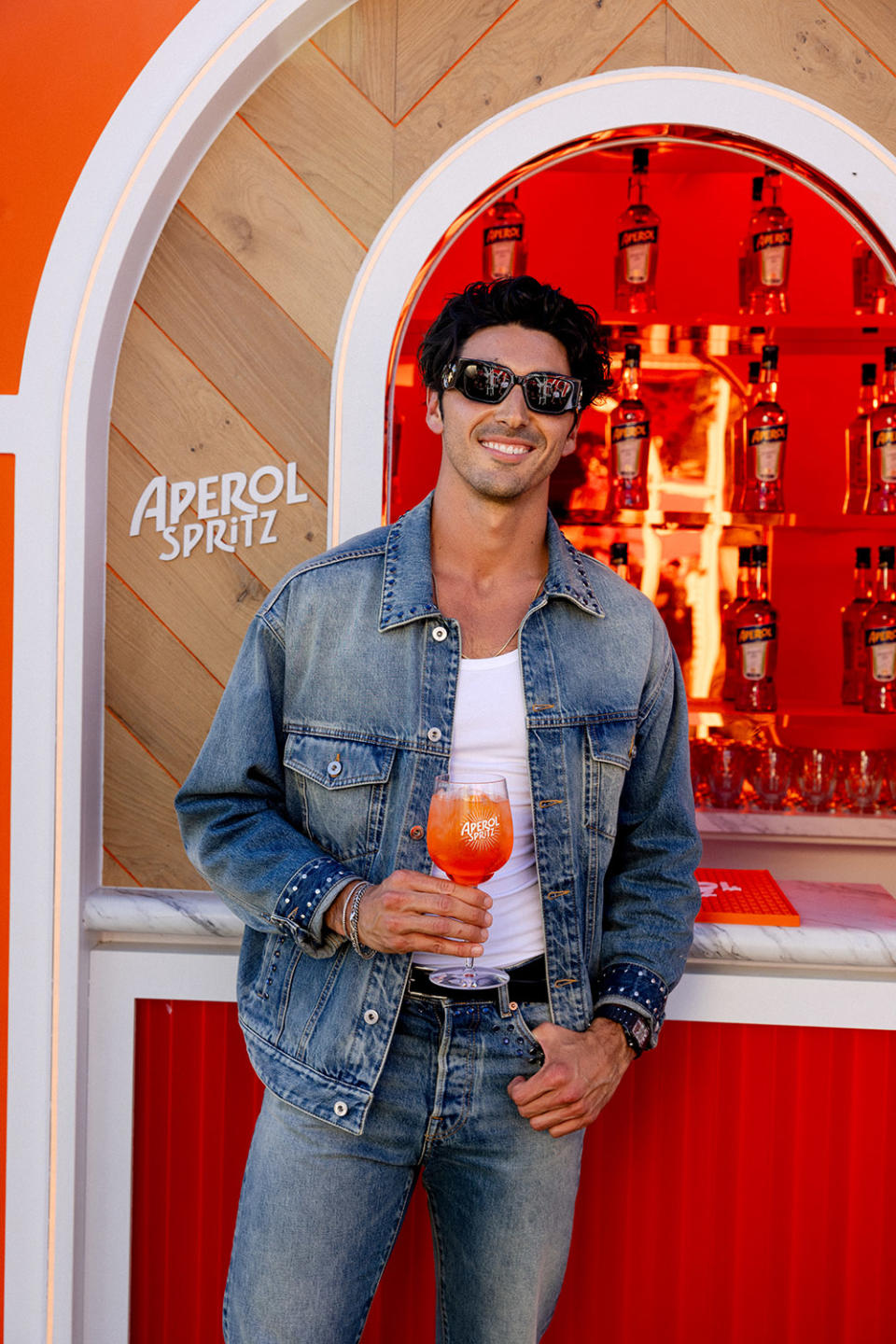 Actor, Taylor Zahkar Perez, enjoys an Aperol Spritz at the new Aperol Terrazza during Coachella’s opening weekend.