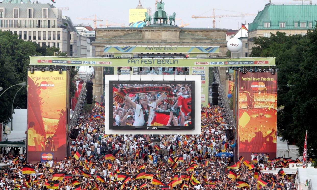 <span>German fans celebrate in Berlin in 2006.</span><span>Photograph: Markus Schreiber/AP</span>