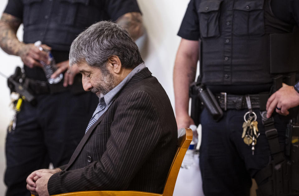 Muhammad Syed takes his seat before opening statements at the Bernalillo County Courthouse in Downtown Albuquerque, N.M,, on Tuesday, March 12, 2024. Syed, an Afghan refugee, is accused in the slayings of three Muslim men in Albuquerque. (Chancey Bush/The Albuquerque Journal via AP, Pool)