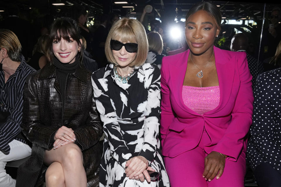 Anne Hathaway, from left, Anna Wintour and Serena Williams attend the Michael Kors Spring/Summer 2023 fashion show on Wednesday, Sept. 14, 2022, in New York. (Photo by Charles Sykes/Invision/AP)